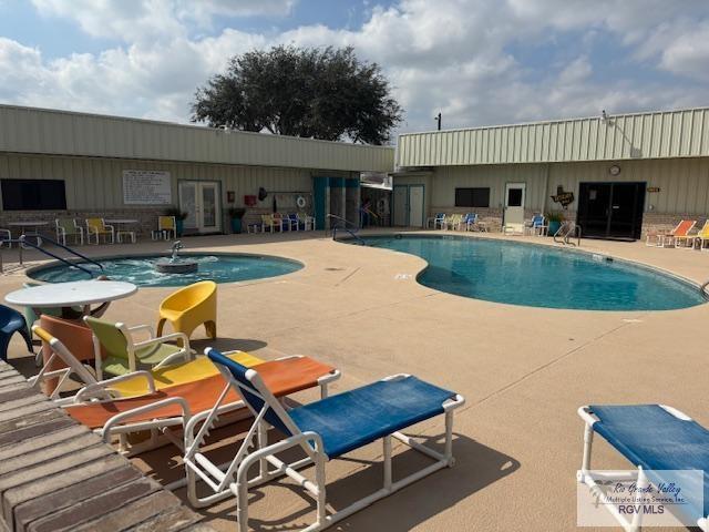 pool featuring french doors and a patio