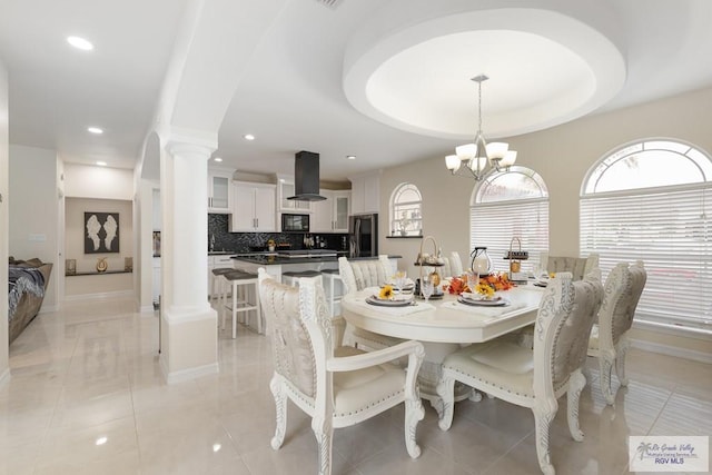 5454 Dragon Wick, Brownsville, TX 78526 - dining space featuring decorative columns, recessed lighting, and a chandelier