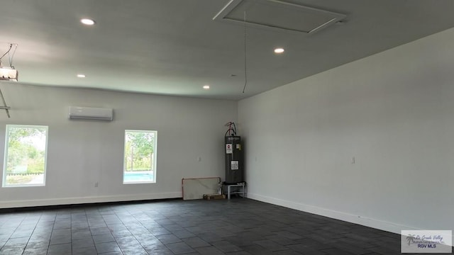 spare room featuring recessed lighting, baseboards, electric water heater, and a wall mounted AC