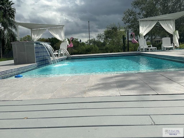 outdoor pool featuring a patio