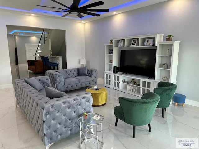 living room featuring recessed lighting, marble finish floor, ceiling fan, and baseboards