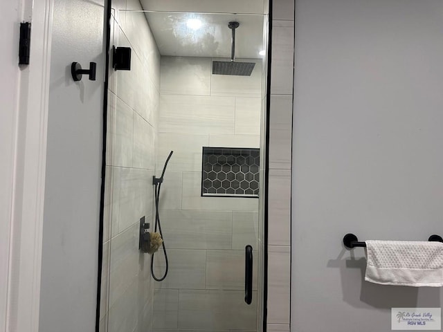 bathroom with a shower stall