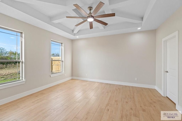 spare room featuring beam ceiling, ceiling fan, coffered ceiling, and light wood-type flooring