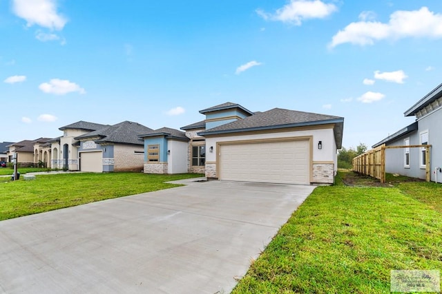 prairie-style home featuring a garage and a front lawn