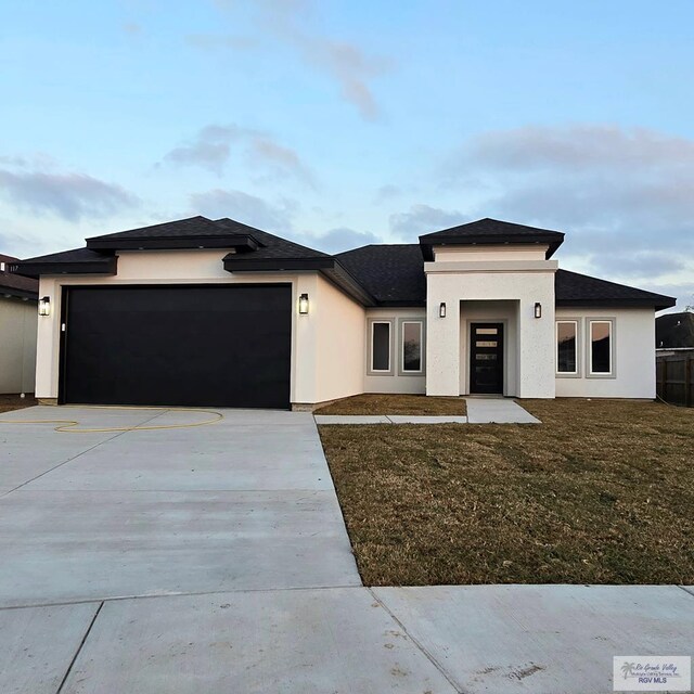 prairie-style home featuring a garage