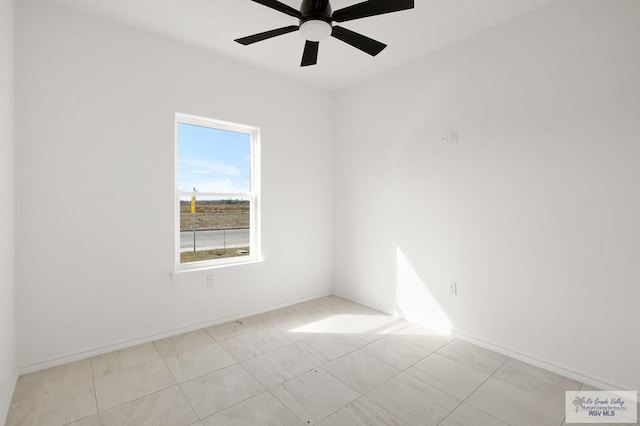 spare room with ceiling fan