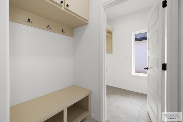 mudroom with light tile patterned floors