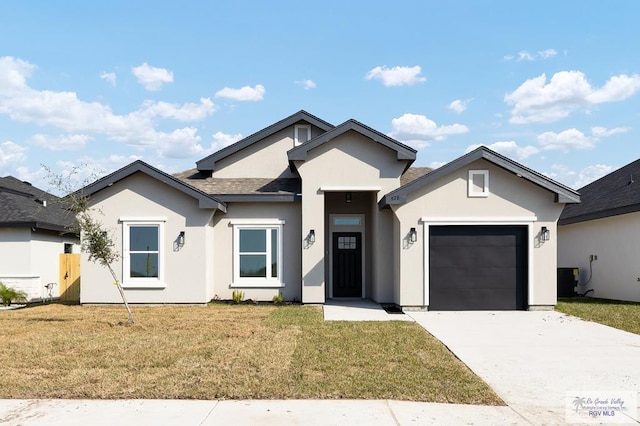 view of front facade featuring a garage and a front yard