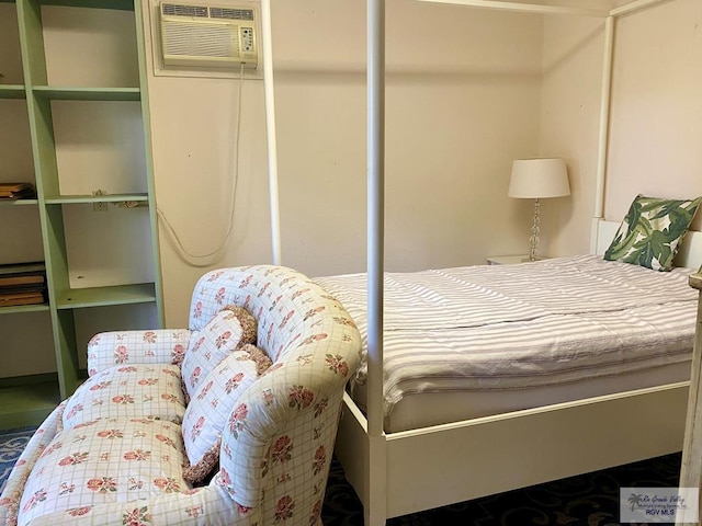 bedroom with a wall mounted air conditioner