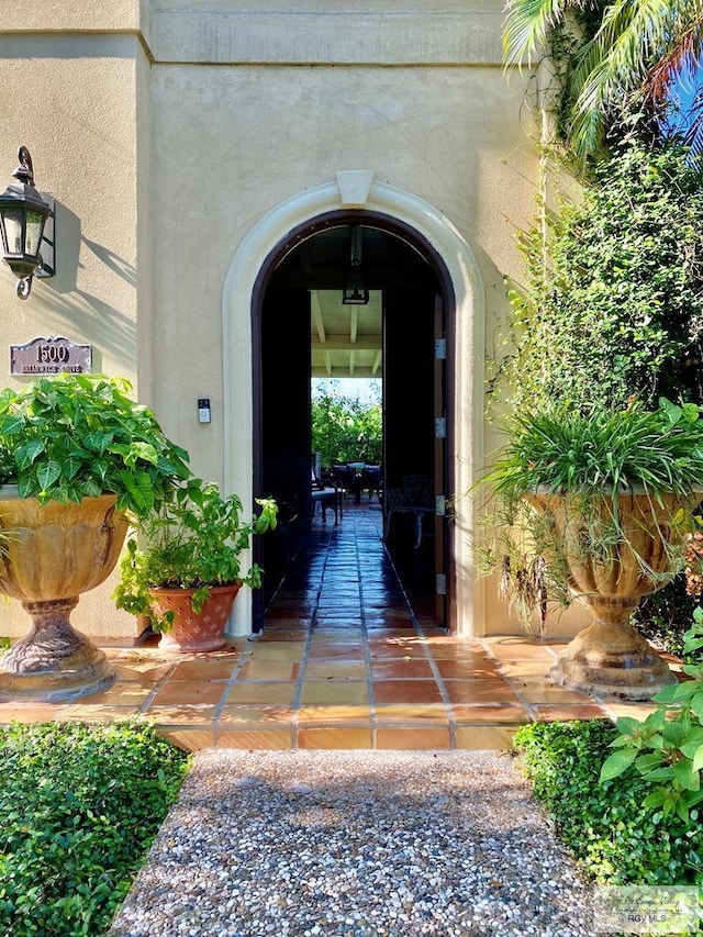 property entrance featuring a patio area