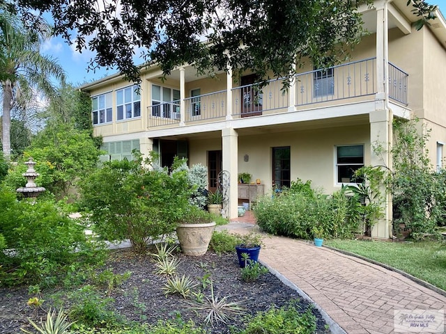 view of front of house with a balcony