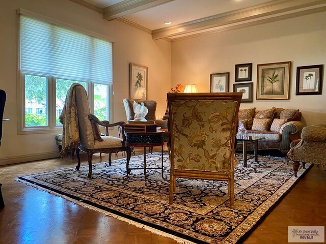 sitting room featuring crown molding, beamed ceiling, and parquet flooring