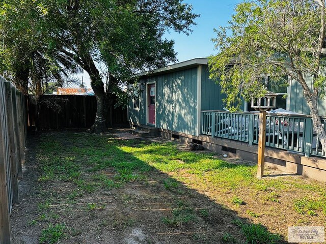 view of yard with a wooden deck