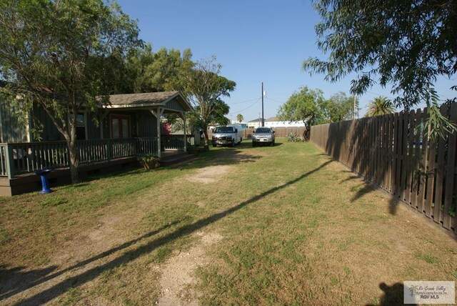 view of yard featuring a wooden deck