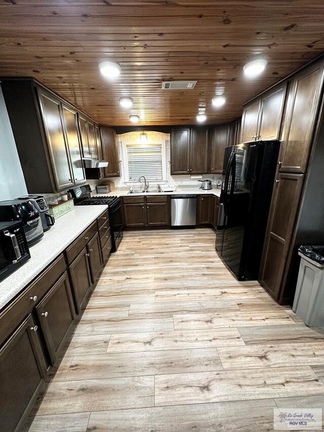 kitchen with sink, light hardwood / wood-style flooring, dark brown cabinetry, and black appliances