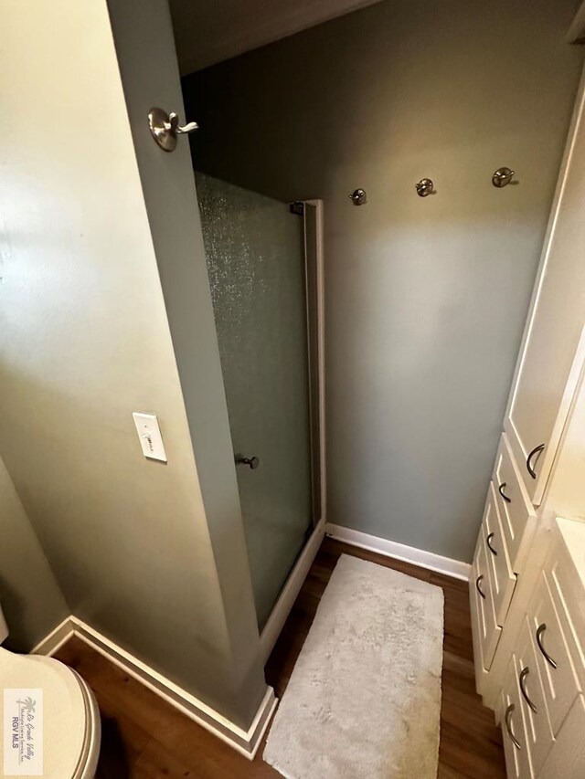 bathroom with hardwood / wood-style floors