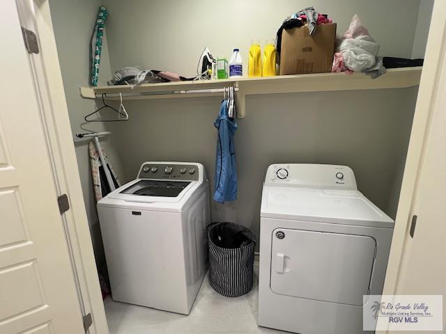 clothes washing area featuring laundry area and independent washer and dryer