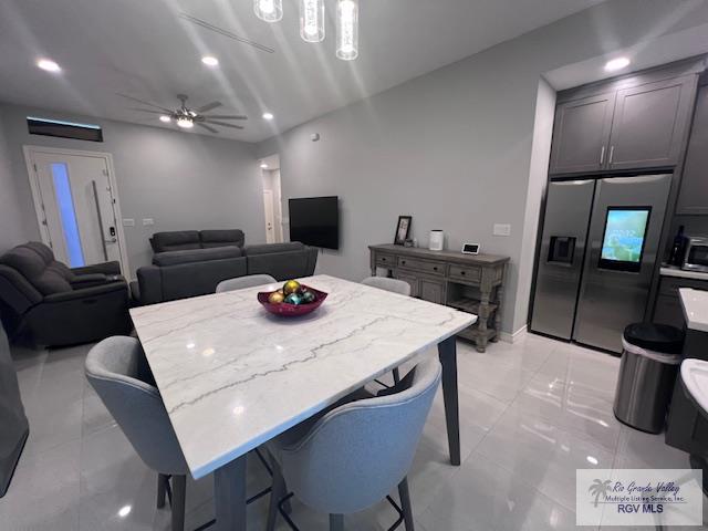 dining area with recessed lighting, baseboards, and ceiling fan