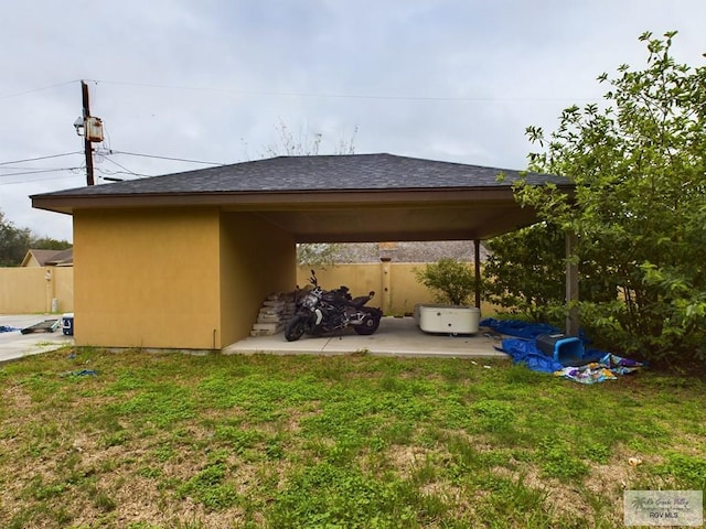 view of car parking with a lawn