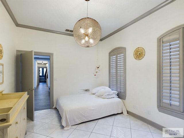 tiled bedroom with crown molding and sink