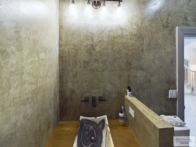 bathroom with hardwood / wood-style flooring