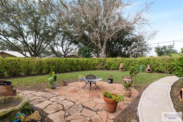 view of patio with a fire pit