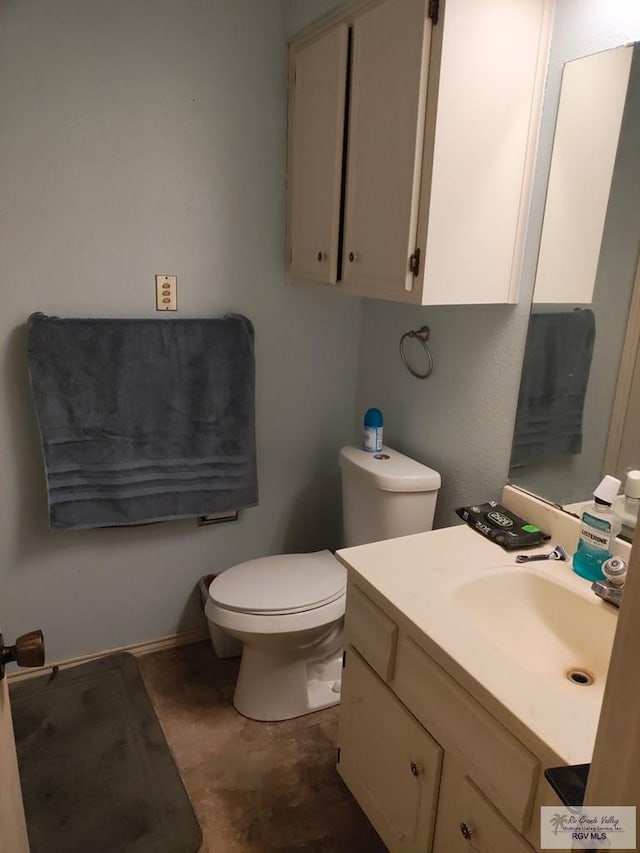 half bath with vanity and toilet