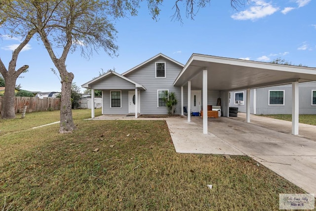 view of front of home with a front lawn and a carport