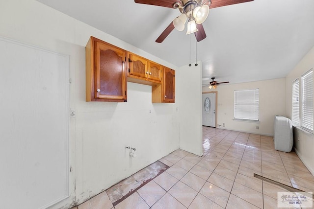 kitchen with ceiling fan and light tile patterned flooring