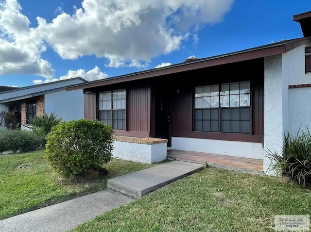 exterior space featuring a lawn