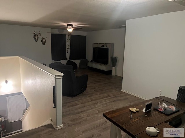 17211 Tangelo Ave, Harlingen, TX 78552 - living area with dark wood finished floors and ceiling fan