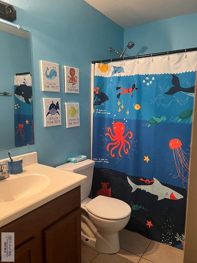 17211 Tangelo Ave, Harlingen, TX 78552 - bathroom featuring tile patterned floors, vanity, and a shower with shower curtain