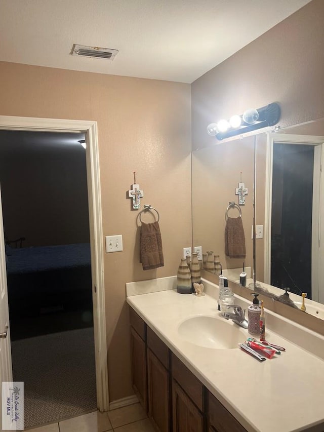 17211 Tangelo Ave, Harlingen, TX 78552 - ensuite bathroom with vanity and tile patterned flooring