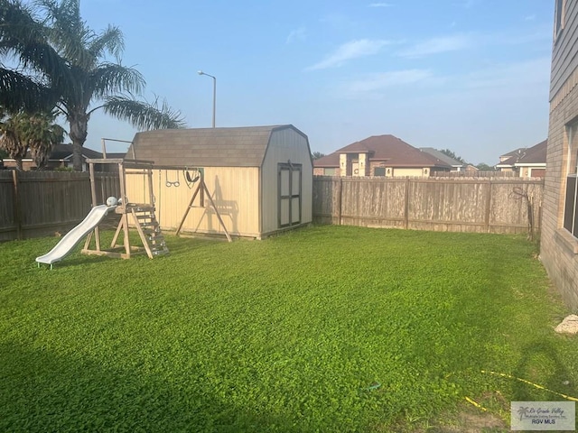 17211 Tangelo Ave, Harlingen, TX 78552 - view of yard featuring a fenced backyard, a shed, and an outdoor structure