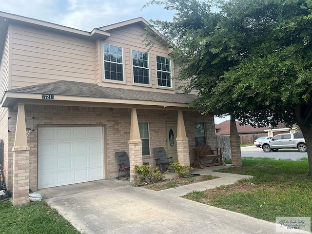 17211 Tangelo Ave, Harlingen, TX 78552 - view of front facade with a porch, a garage, brick siding, concrete driveway, and a shingled roof