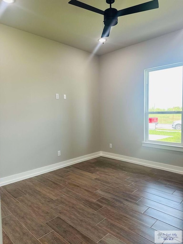 3617 Mattie Ln, Harlingen, TX 78550 - unfurnished room featuring dark wood-style floors, ceiling fan, and baseboards