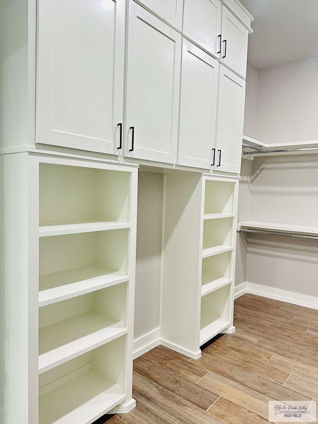 3617 Mattie Ln, Harlingen, TX 78550 - walk in closet featuring light wood-style floors