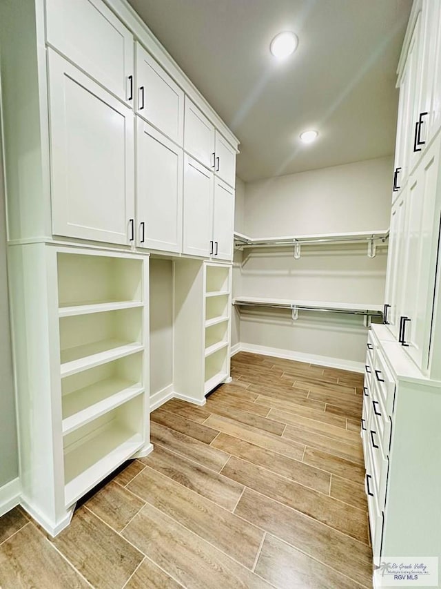 3617 Mattie Ln, Harlingen, TX 78550 - spacious closet with light wood-style floors