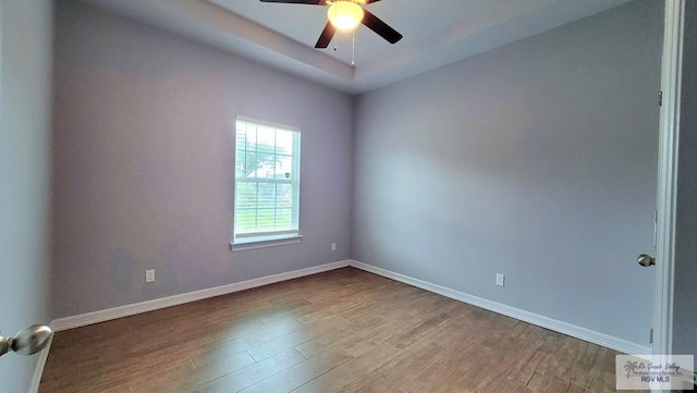 empty room featuring light wood-type flooring and ceiling fan