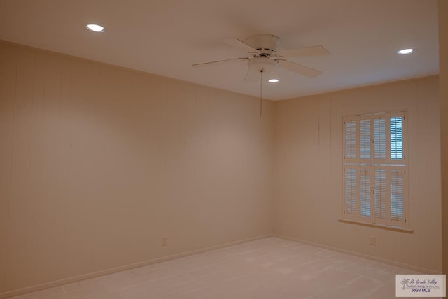 spare room with ceiling fan and carpet flooring