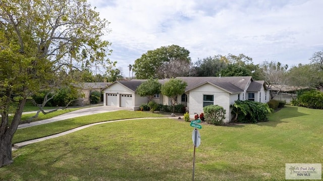 ranch-style home featuring a garage and a front yard