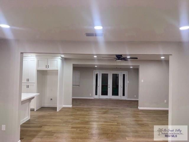 interior space with ceiling fan, wood finished floors, and recessed lighting