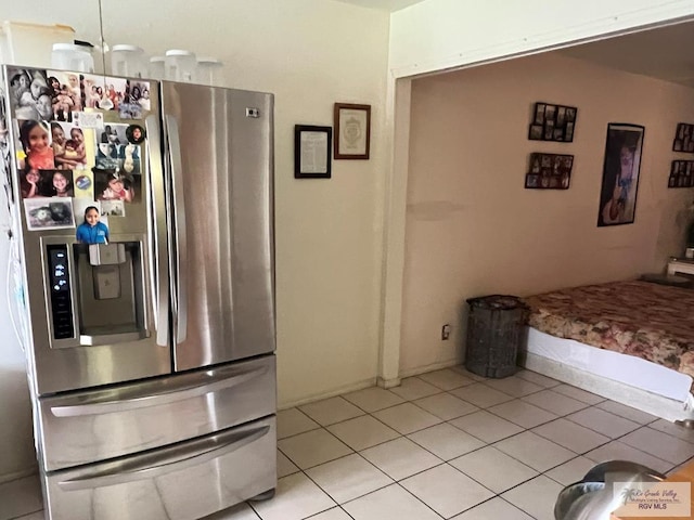 12 Palmetto Ct, Brownsville, TX 78521 - kitchen with stainless steel fridge and light tile patterned floors