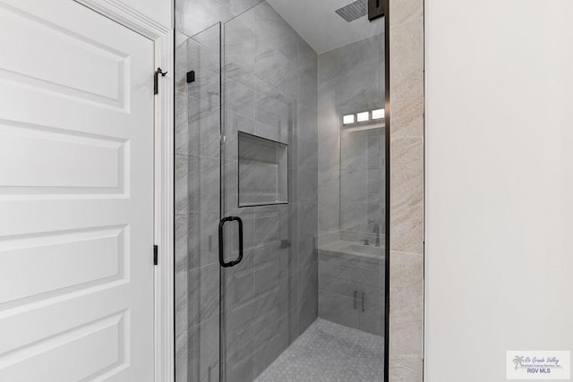 bathroom with an enclosed shower