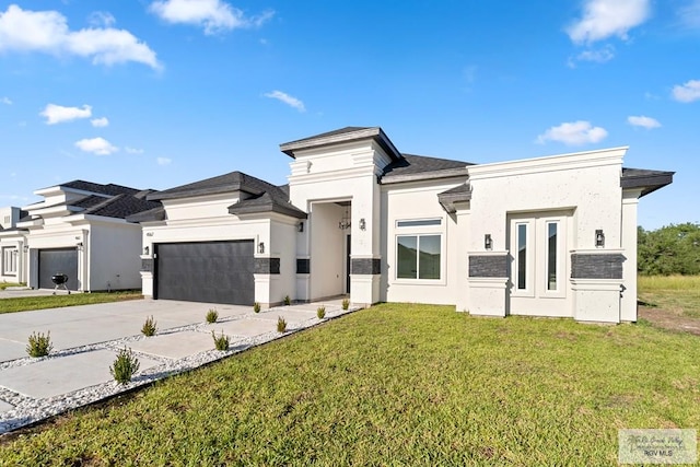 view of front of house with a front lawn and a garage