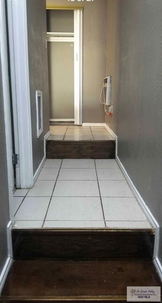 corridor featuring tile patterned floors