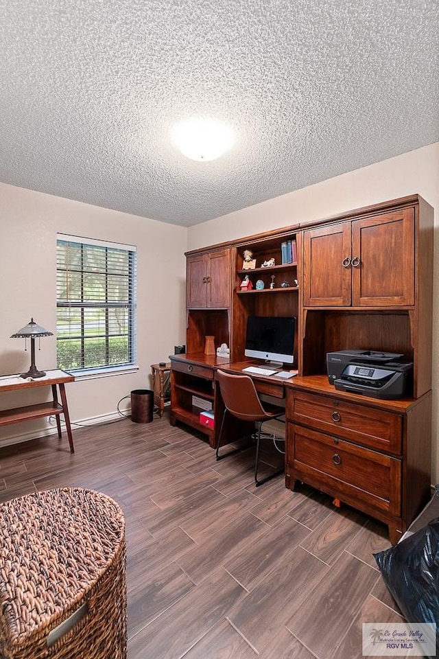 24382 Preston Trl, Harlingen, TX 78552 - home office featuring a textured ceiling and dark wood-style flooring