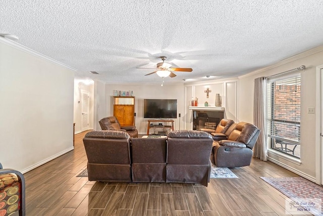 24382 Preston Trl, Harlingen, TX 78552 - living area with ornamental molding, wood finished floors, ceiling fan, and a textured ceiling