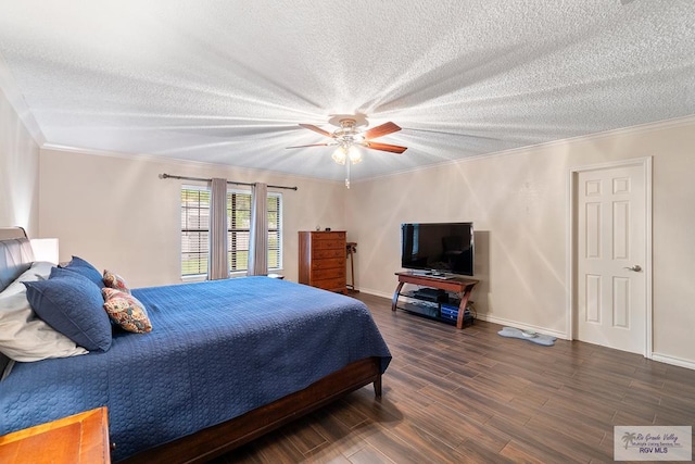24382 Preston Trl, Harlingen, TX 78552 - bedroom with a textured ceiling, crown molding, wood finished floors, and a ceiling fan