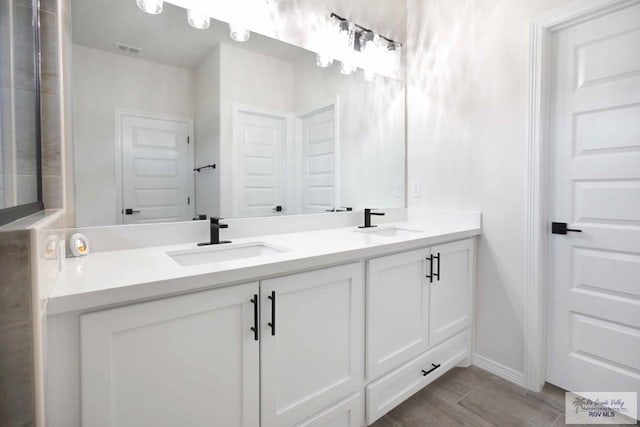 1838 Miley Ln, Harlingen, TX 78550 - full bath featuring double vanity and wood finished floors